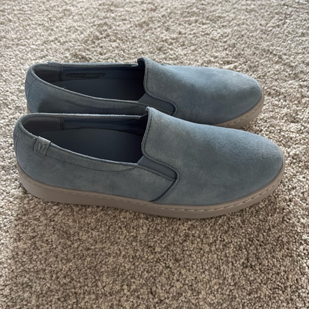 Adorable blue slip-on sneakers.